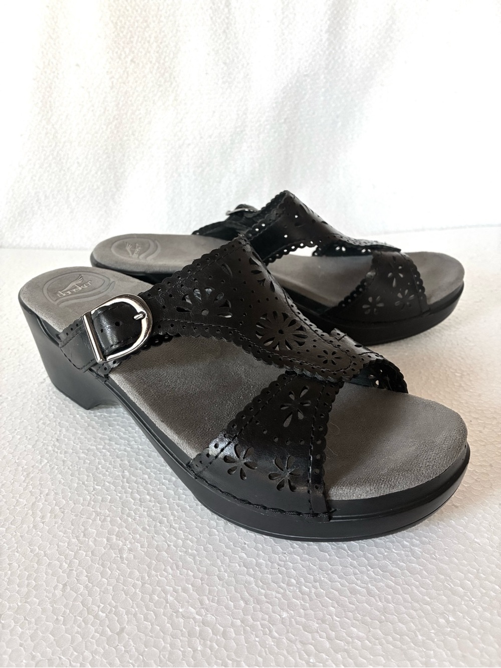 Dansko Black Laser-Cut Leather Slide Sandals with Buckle Accent